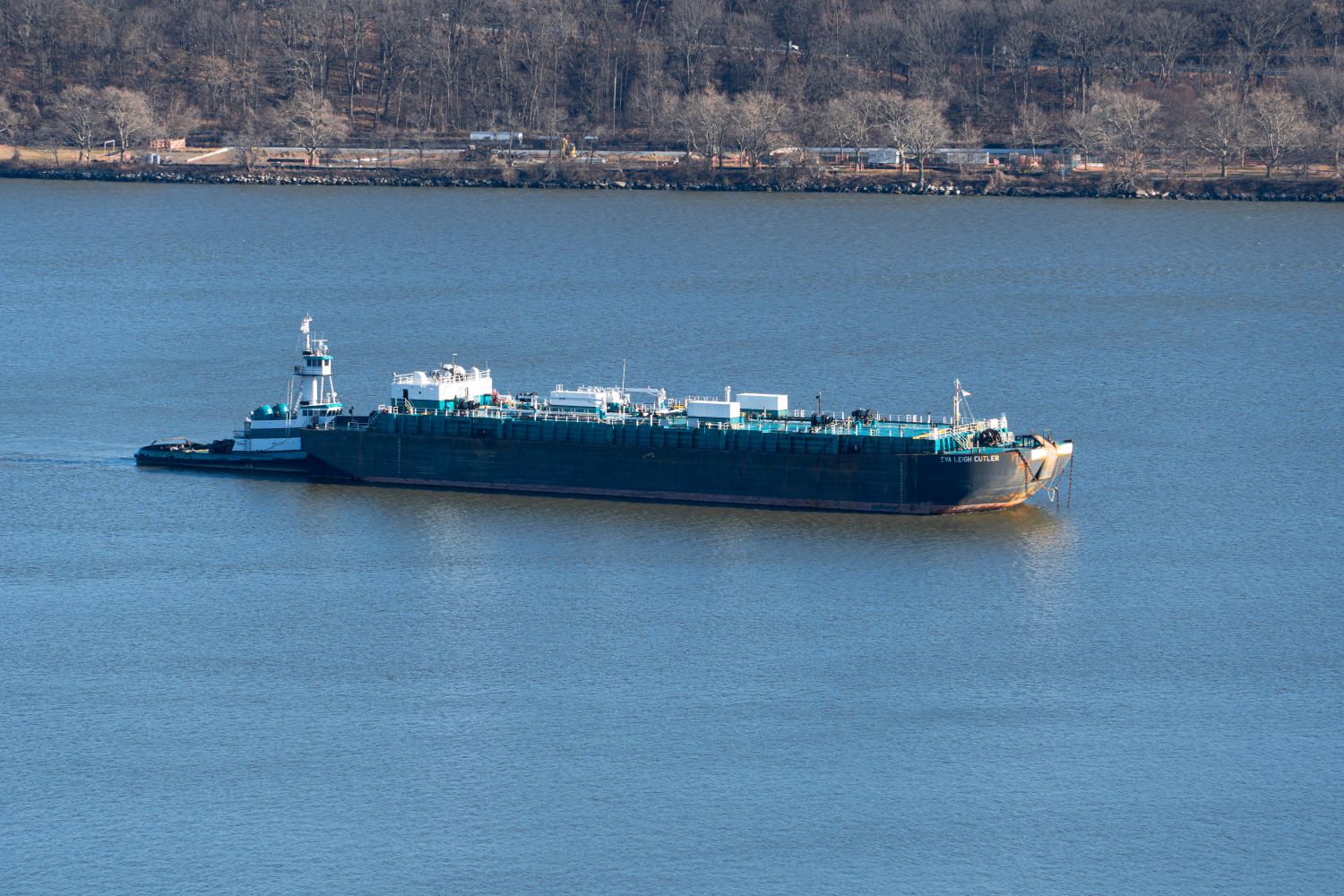 industrial barge on a calm river waterway